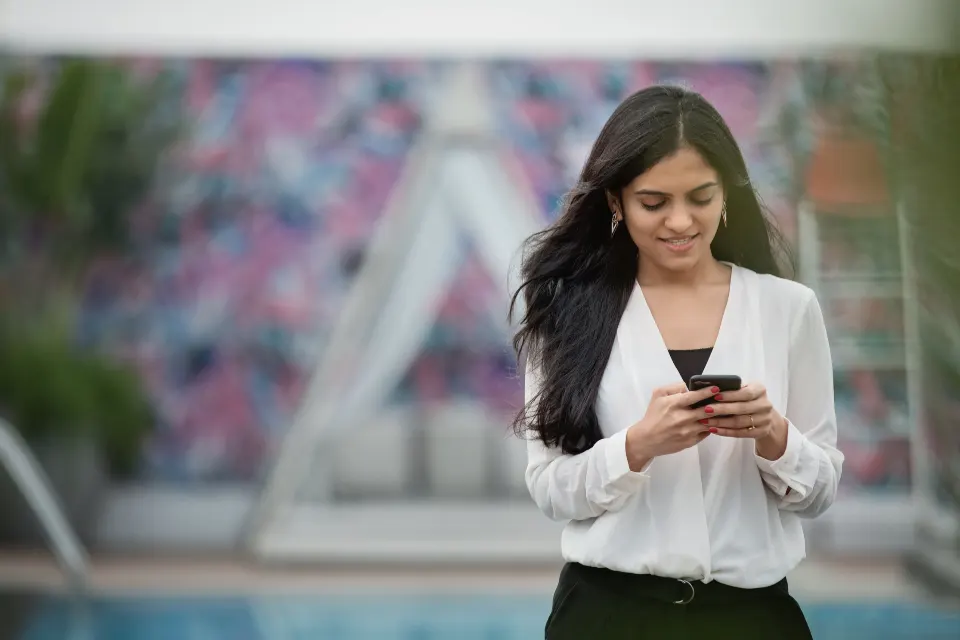 Young woman looking at her smartphone
